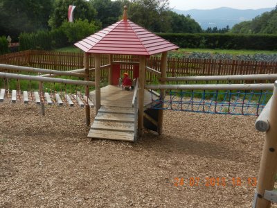 Playground with climbing frame and slide